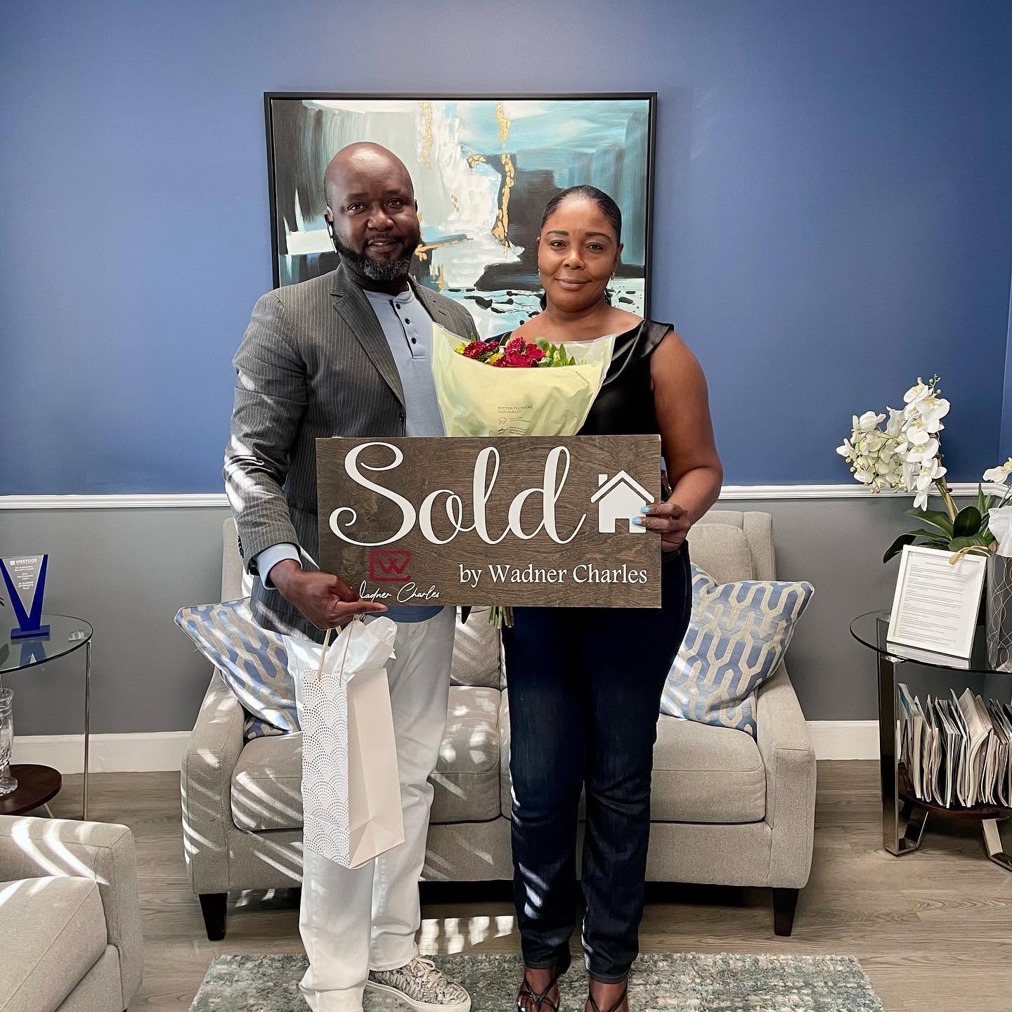 Wadner Charles with his clients at closing in Tamarac, FL