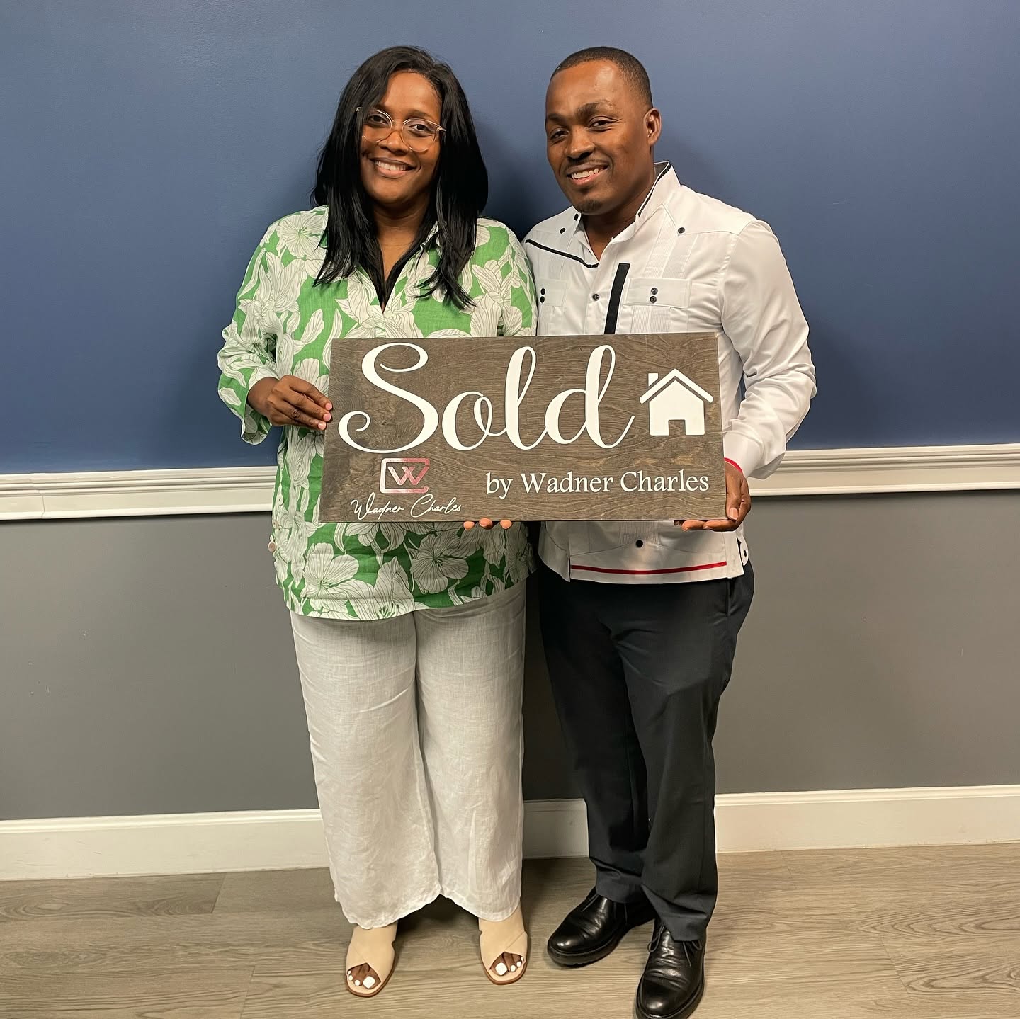 Wadner Charles with his clients at closing in Tamarac, FL