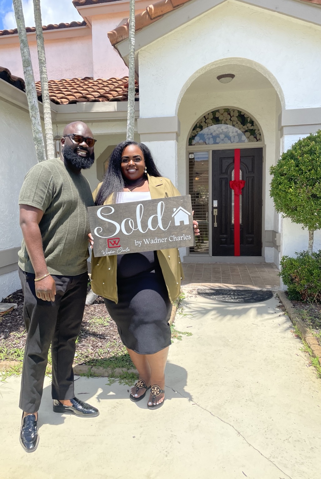 Wadner Charles with his clients at closing in Wellington, FL