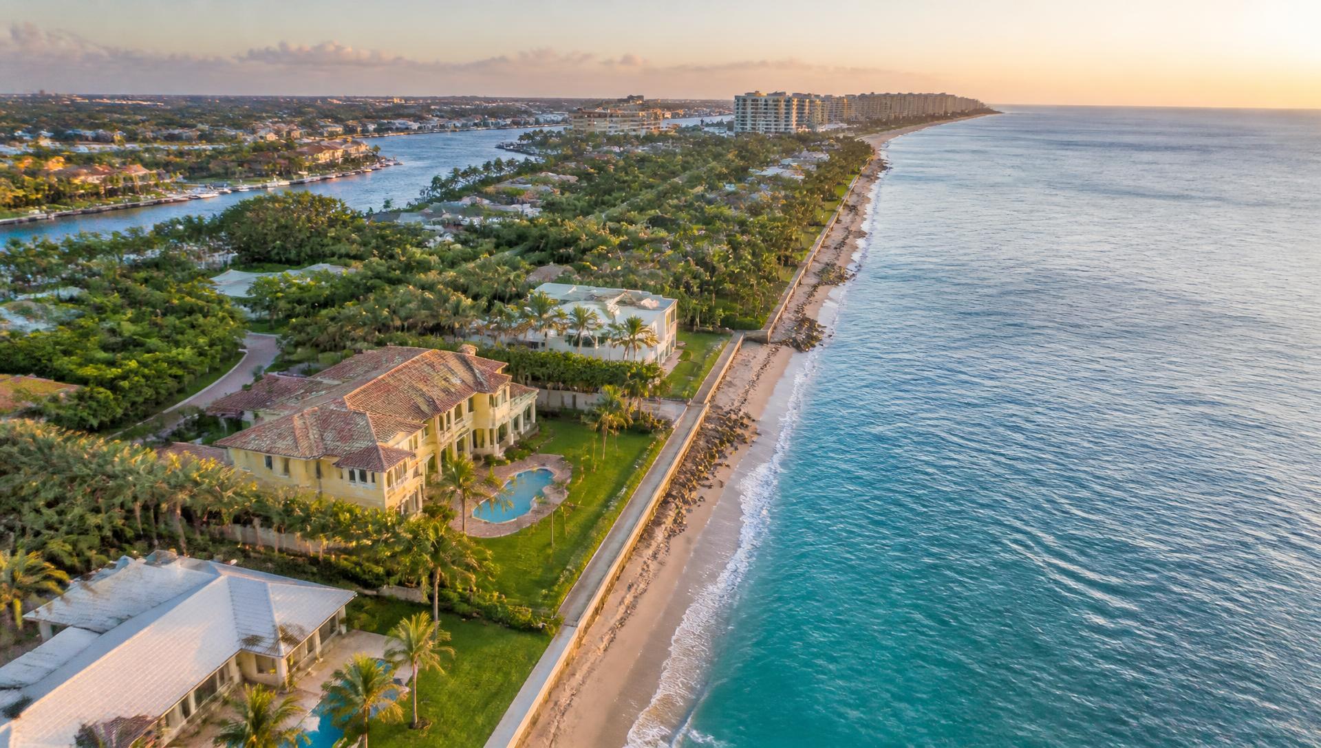 Aerial view of the Boca Raton, Florida coastline with oceanfront estates and the Intracoastal Waterway at sunset